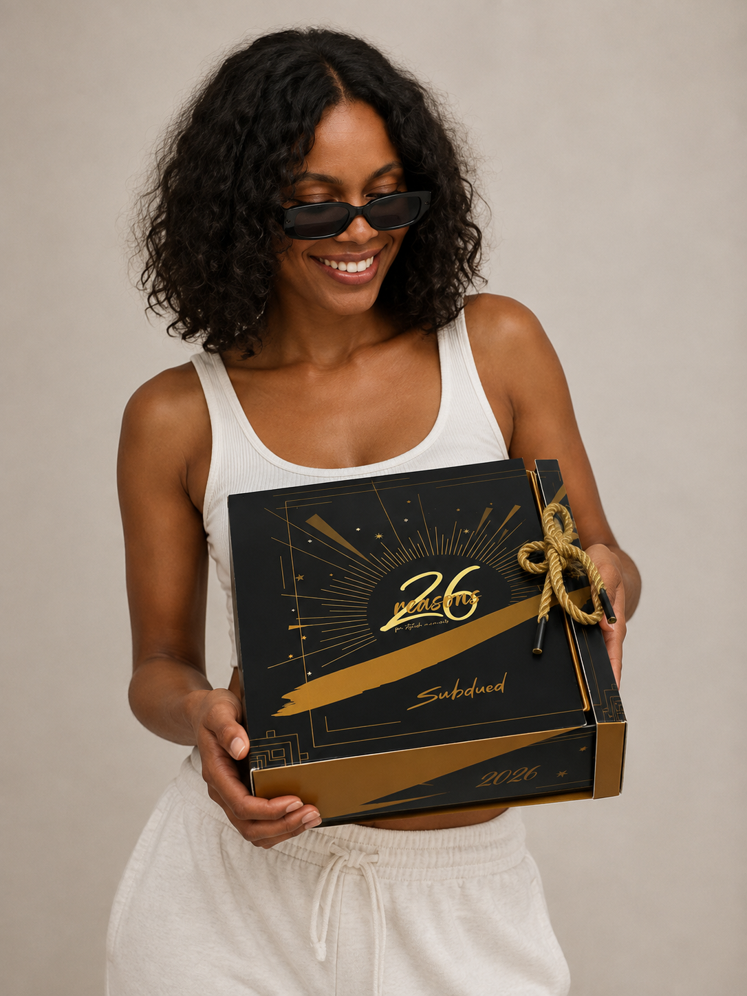 Subdued final mockup — model holding the closed box