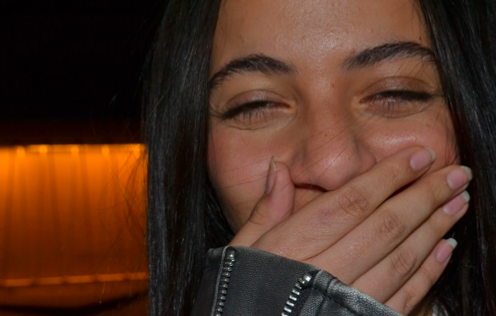 PORTRAIT — covering a laugh