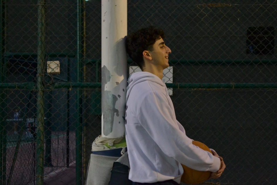 NARRATIVE — holding the ball, courtside