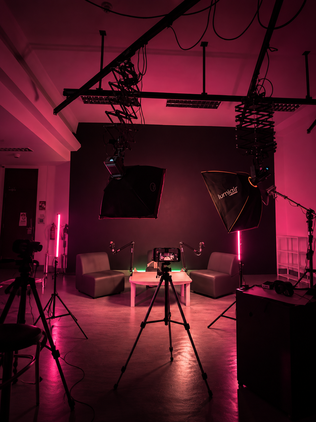 Studio setup — magenta-lit production space