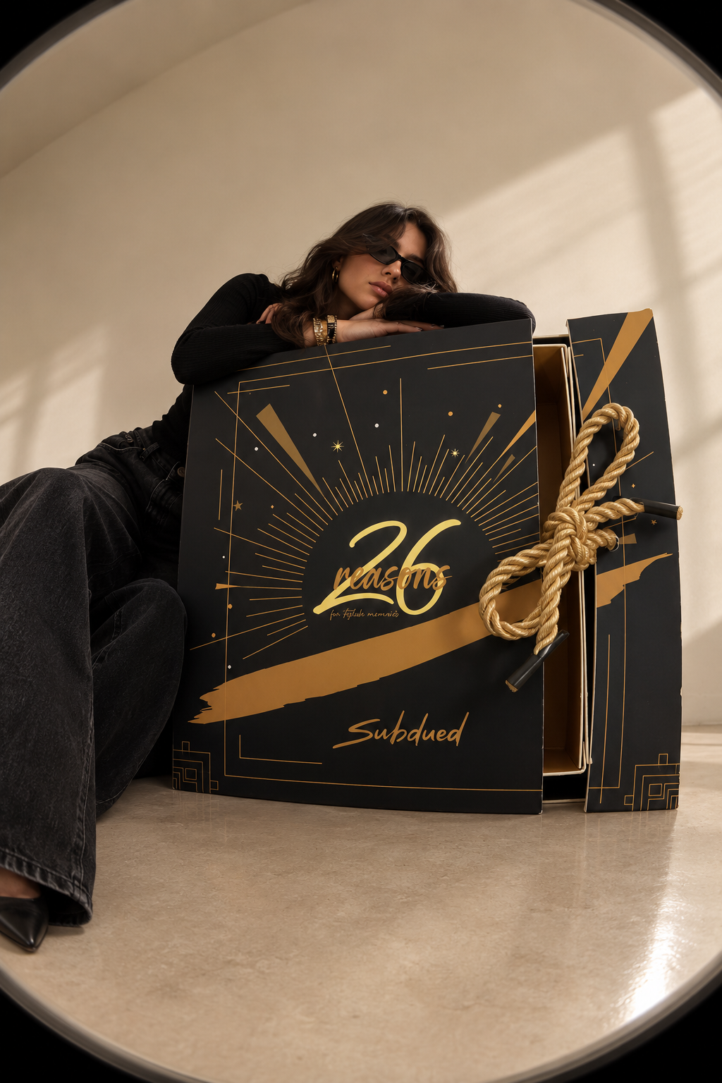 Subdued final mockup — model with the 26 Reasons box